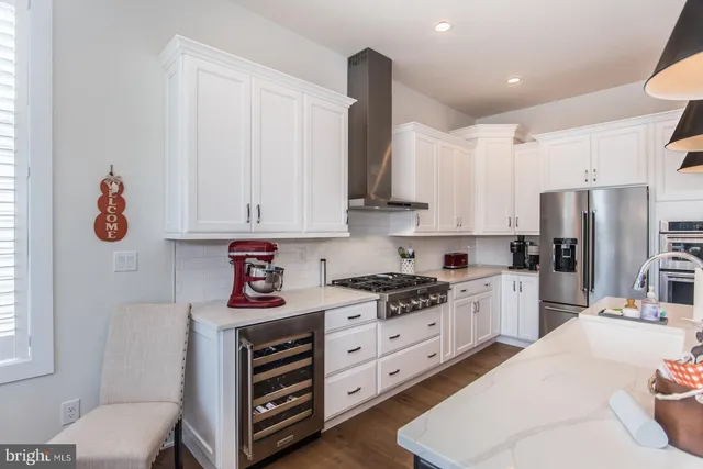 a bathroom with a double vanity sink a mirror and a shower