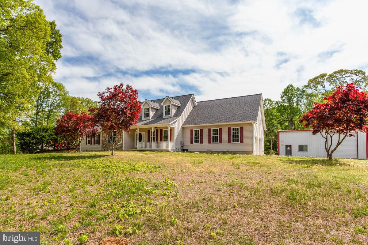 400 Adelina Road Prince Frederick, MD 20678 - Photo 2 of 57 Charming home with vibrant landscaping.