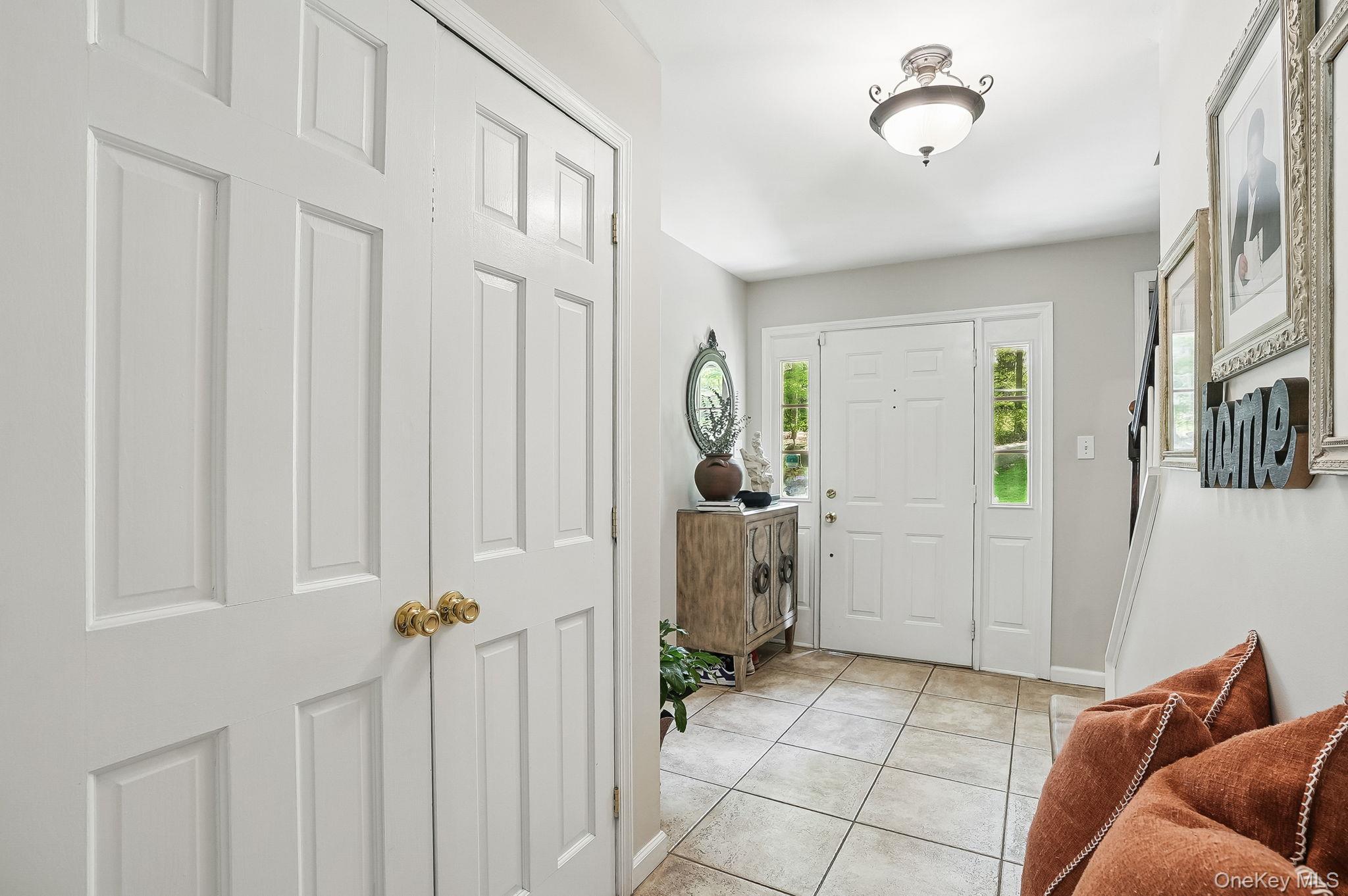 304 Church Road Putnam Valley, NY 10579 - Photo 4 of 50 Foyer featuring light tile patterned flooring and baseboards