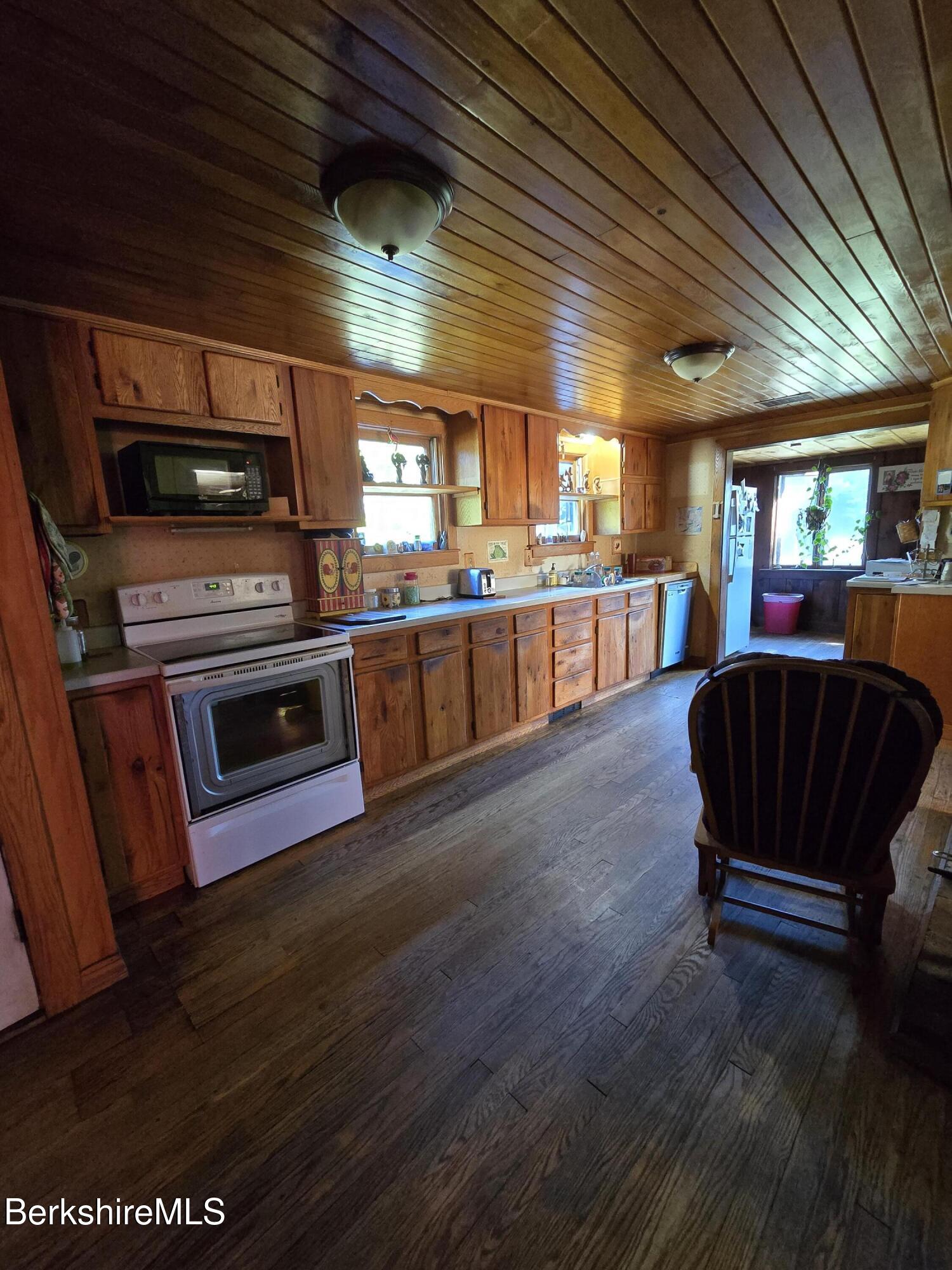 266 Robillard Road Stamford, VT 05352 - Photo 13 of 45 Kitchen looking back into sunroom