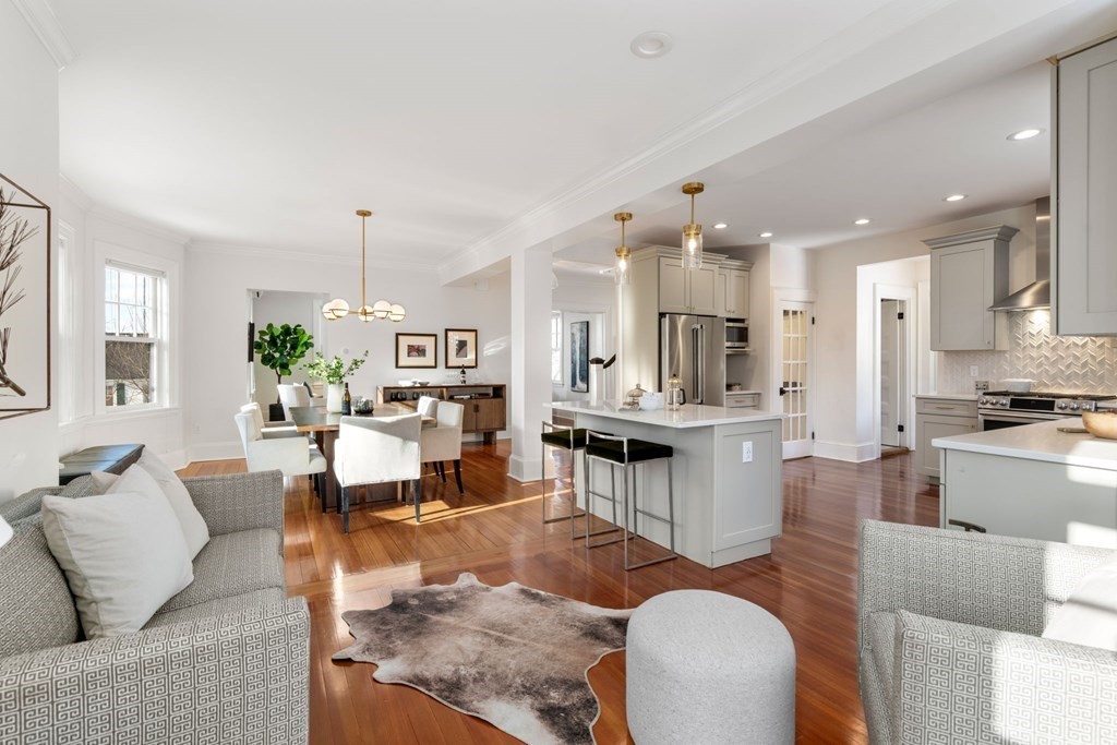 24 Maxfield Street Boston, MA 02132 - Photo 13 of 36 a living room with furniture kitchen and a chandelier