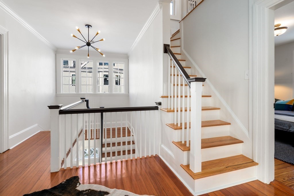 24 Maxfield Street Boston, MA 02132 - Photo 19 of 36 a view of entryway with wooden floor