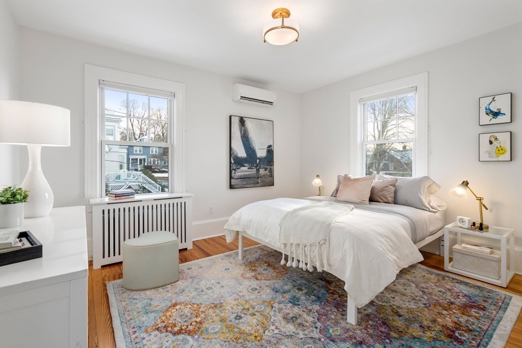 24 Maxfield Street Boston, MA 02132 - Photo 21 of 36 a bedroom with a bed and a window