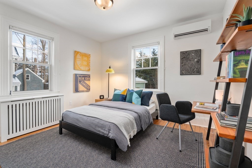 24 Maxfield Street Boston, MA 02132 - Photo 22 of 36 a bedroom with a bed and a window