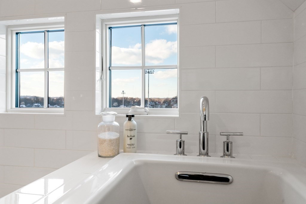 24 Maxfield Street Boston, MA 02132 - Photo 30 of 36 a bathroom with a tub sink and window