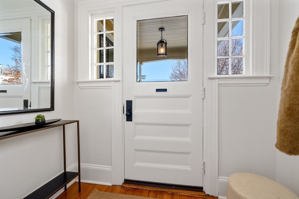 24 Maxfield Street Boston, MA 02132 - Photo 3 of 36 a bathroom with a toilet and a window