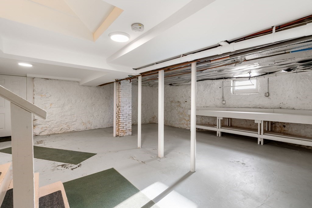 24 Maxfield Street Boston, MA 02132 - Photo 31 of 36 a view of room with walk in closet and window