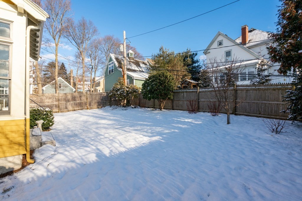 24 Maxfield Street Boston, MA 02132 - Photo 33 of 36 a view of a house with a backyard