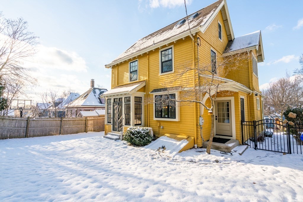 24 Maxfield Street Boston, MA 02132 - Photo 34 of 36 a view of a blue house with a yard