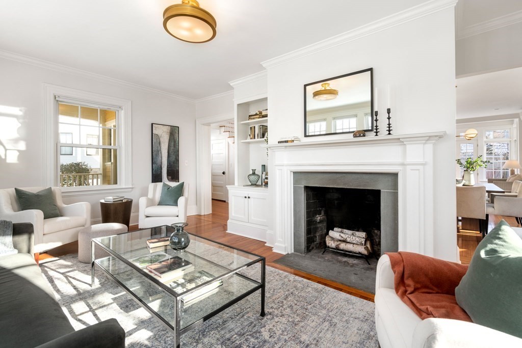 24 Maxfield Street Boston, MA 02132 - Photo 5 of 36 a living room with furniture a rug and a fireplace
