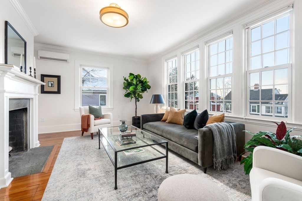 24 Maxfield Street Boston, MA 02132 - Photo 6 of 36 a living room with furniture fireplace and a large window