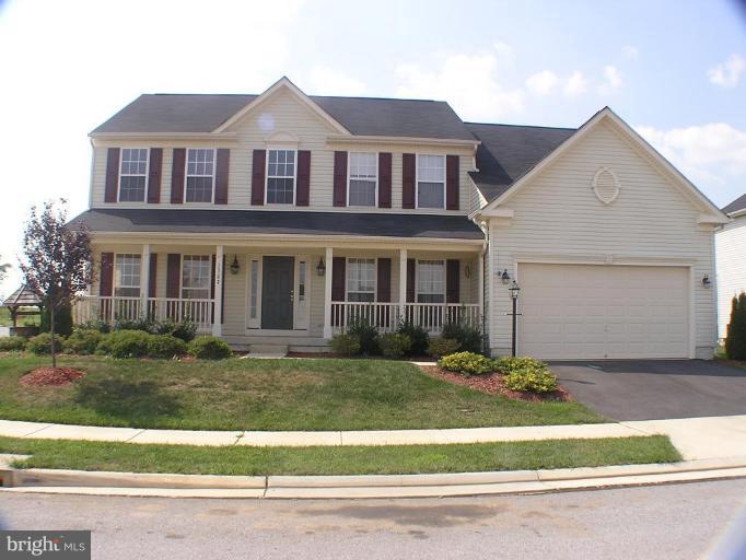 1307 Destrier Street Ranson, WV 25438 - Photo 1 of 15 a front view of a house with a yard