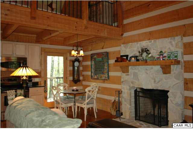 1208 Duet Road Madison, VA 22727 - Photo 12 of 29 a living room with furniture a fireplace and a table