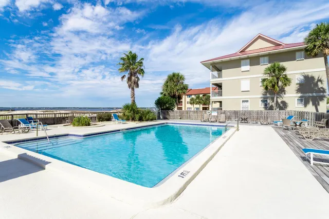 a view of a house with backyard and garden