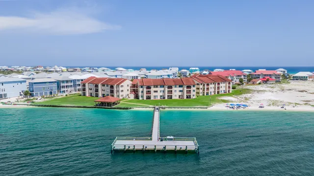 a view of a garden with a building in the background