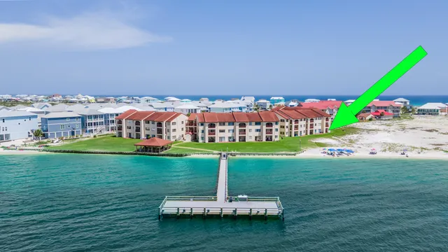 a view of a garden with a building in the background