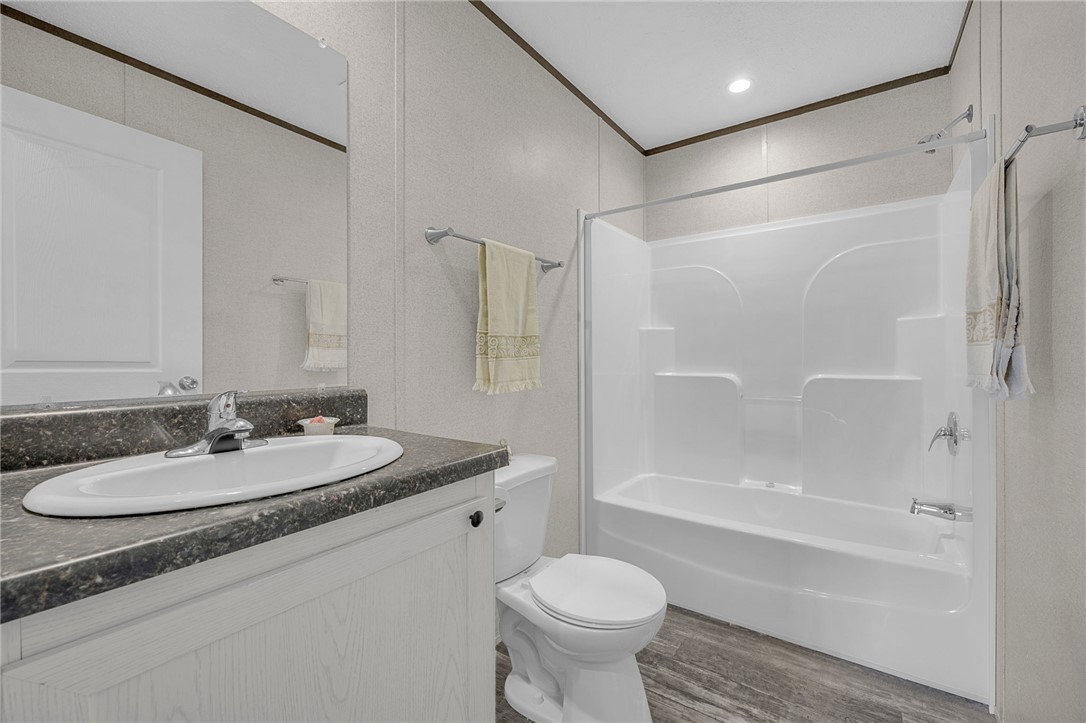 375 Griggs Road Six Mile, SC 29682 - Photo 24 of 36 This bathroom features a contemporary vanity and a combined shower-bathtub unit, offering both style and utility.