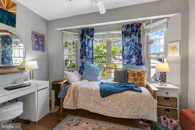 a bedroom with a bed and a table