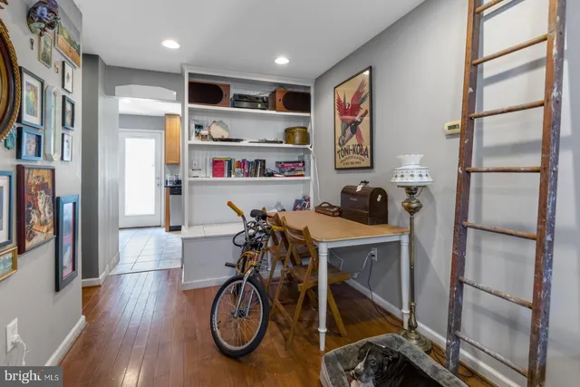 a view of a kitchen and an empty room
