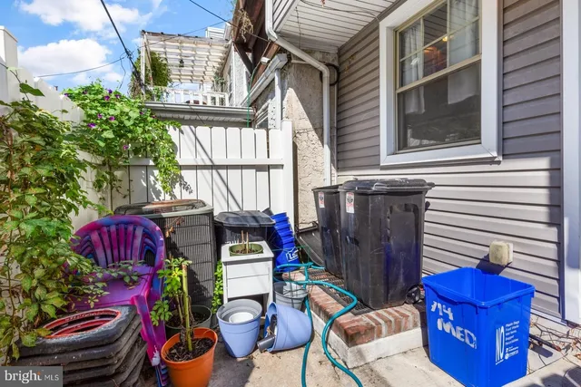 a view of a chairs and table in backyard