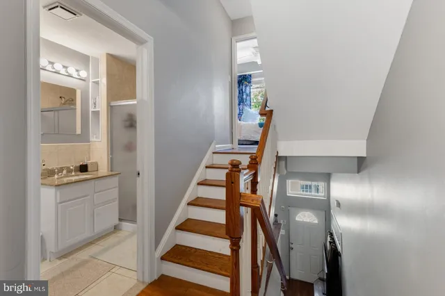 a view of entryway and hall with wooden floor