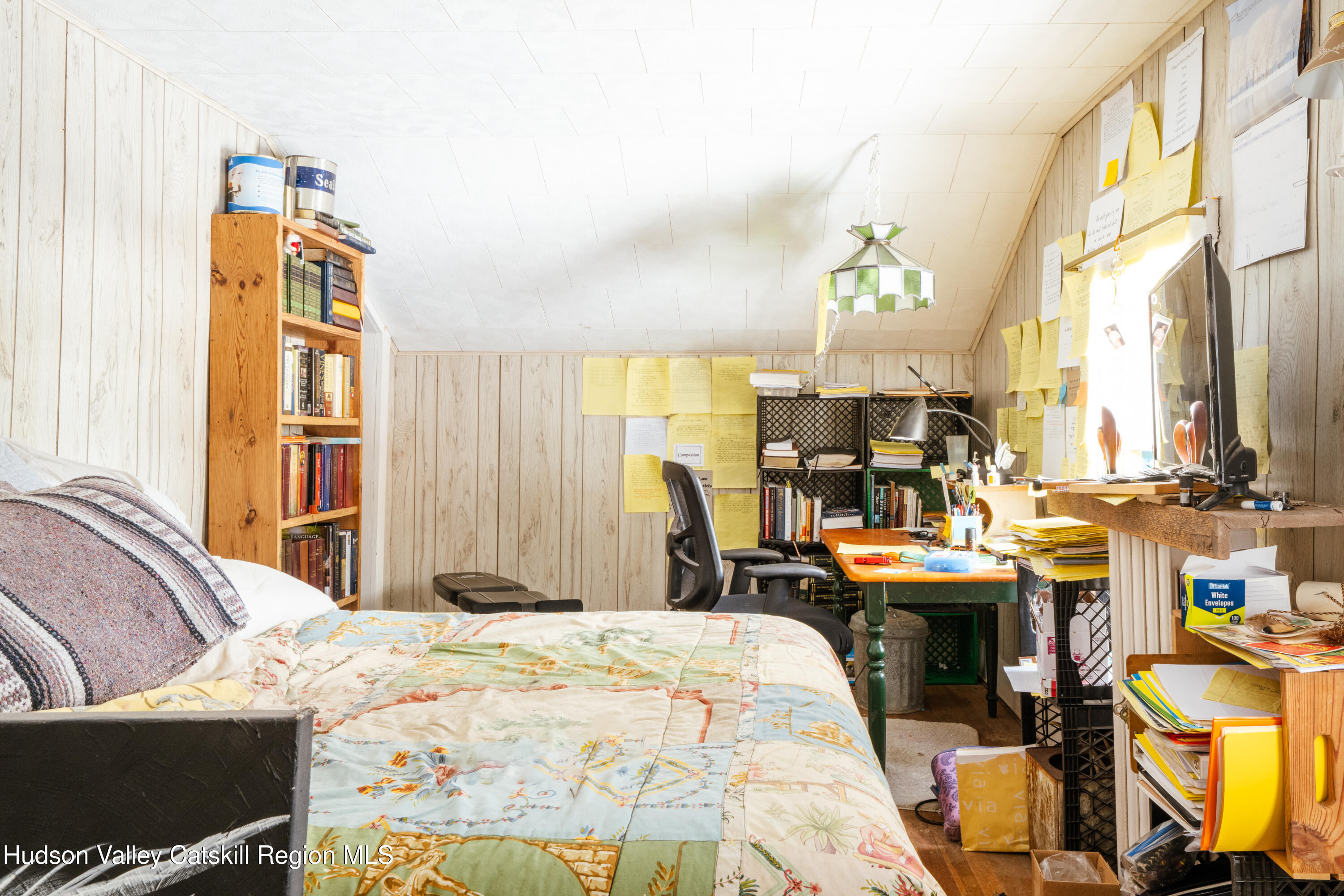 5020 Vega Mountain Road Roxbury, NY 12474 - Photo 18 of 31 a bed room with a bed a table chair and a window