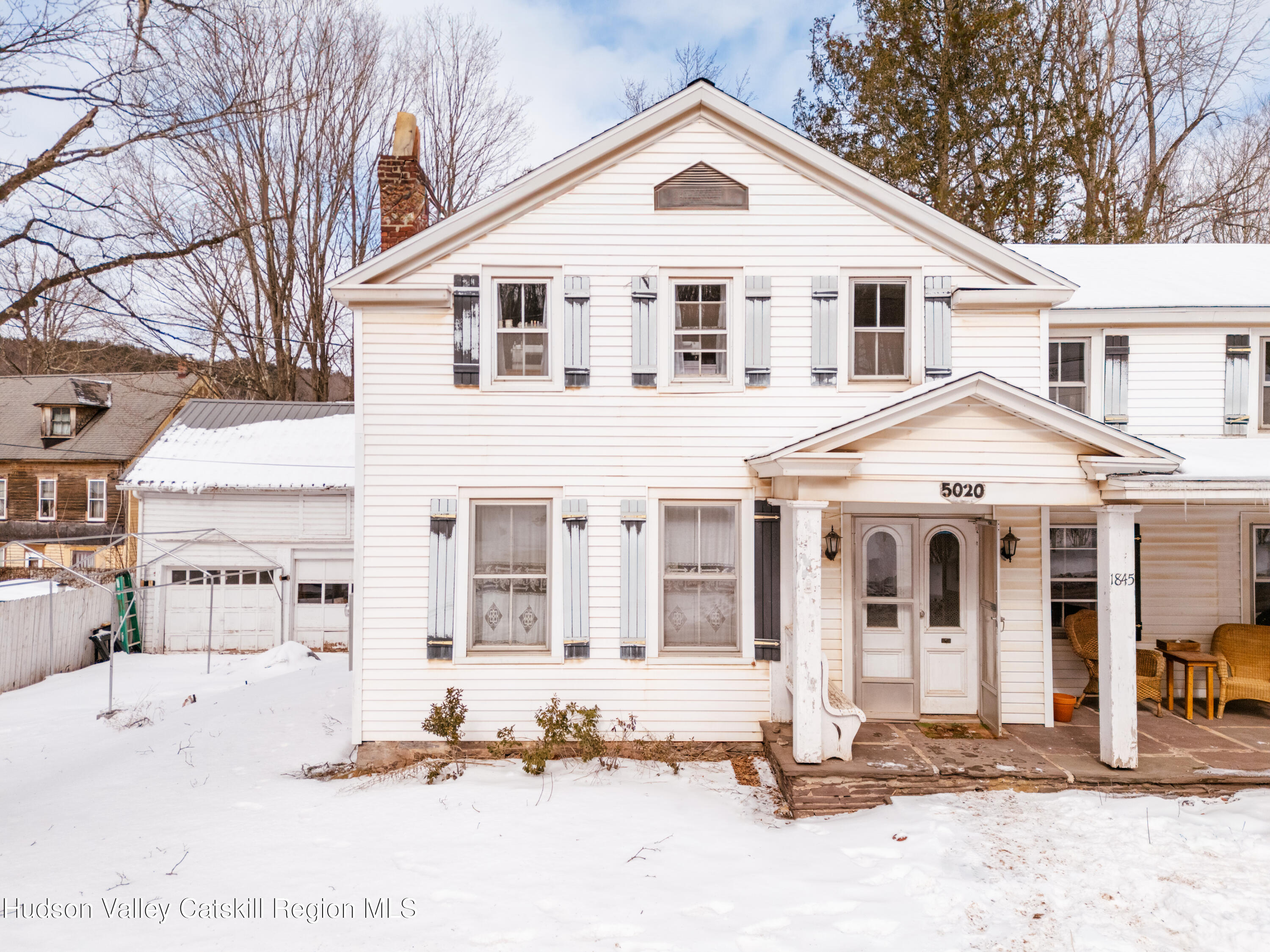 5020 Vega Mountain Road Roxbury, NY 12474 - Photo 25 of 31 a view of white house with a yard and large tree