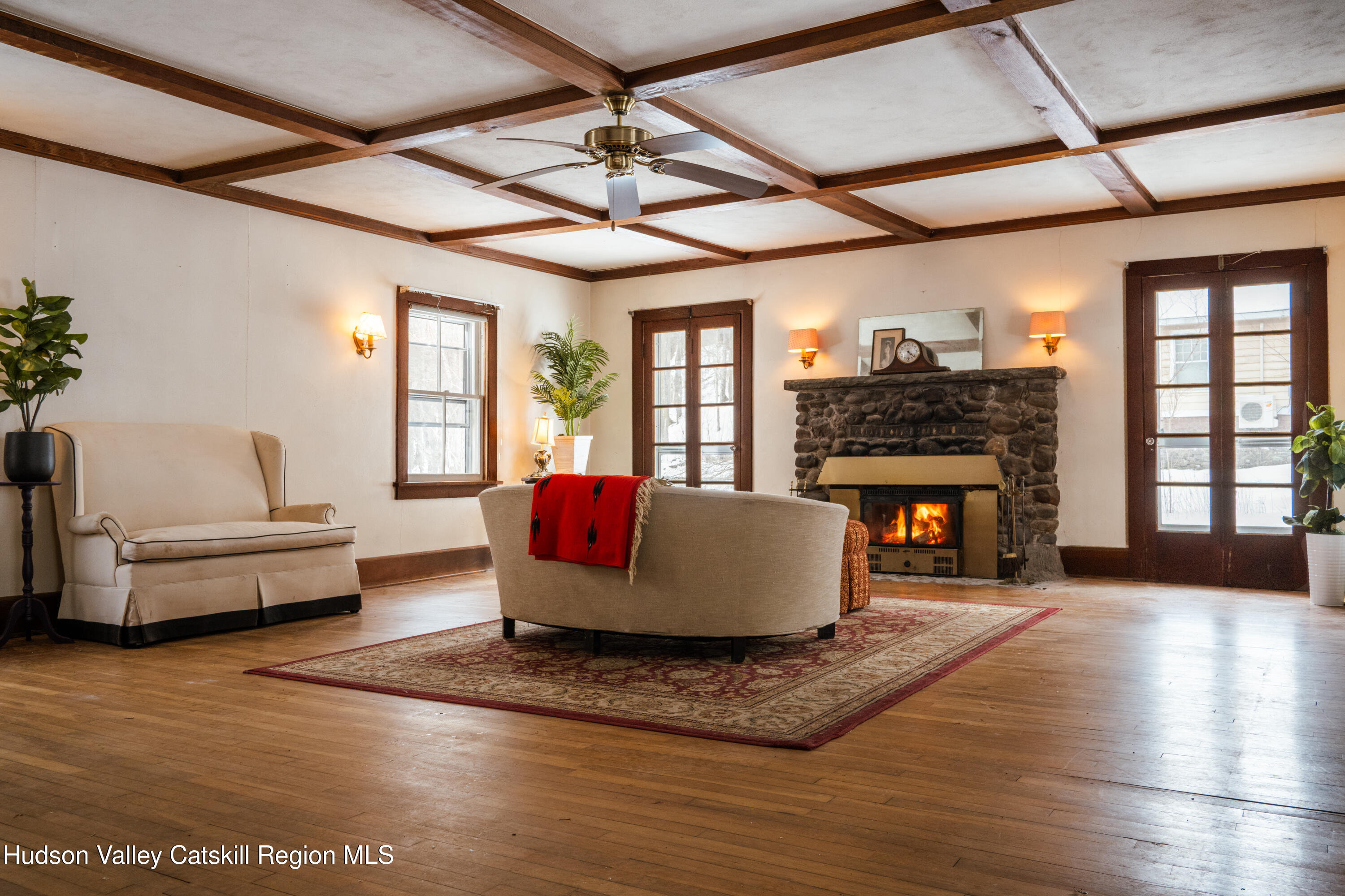 5020 Vega Mountain Road Roxbury, NY 12474 - Photo 8 of 31 a living room with furniture a fireplace and a table