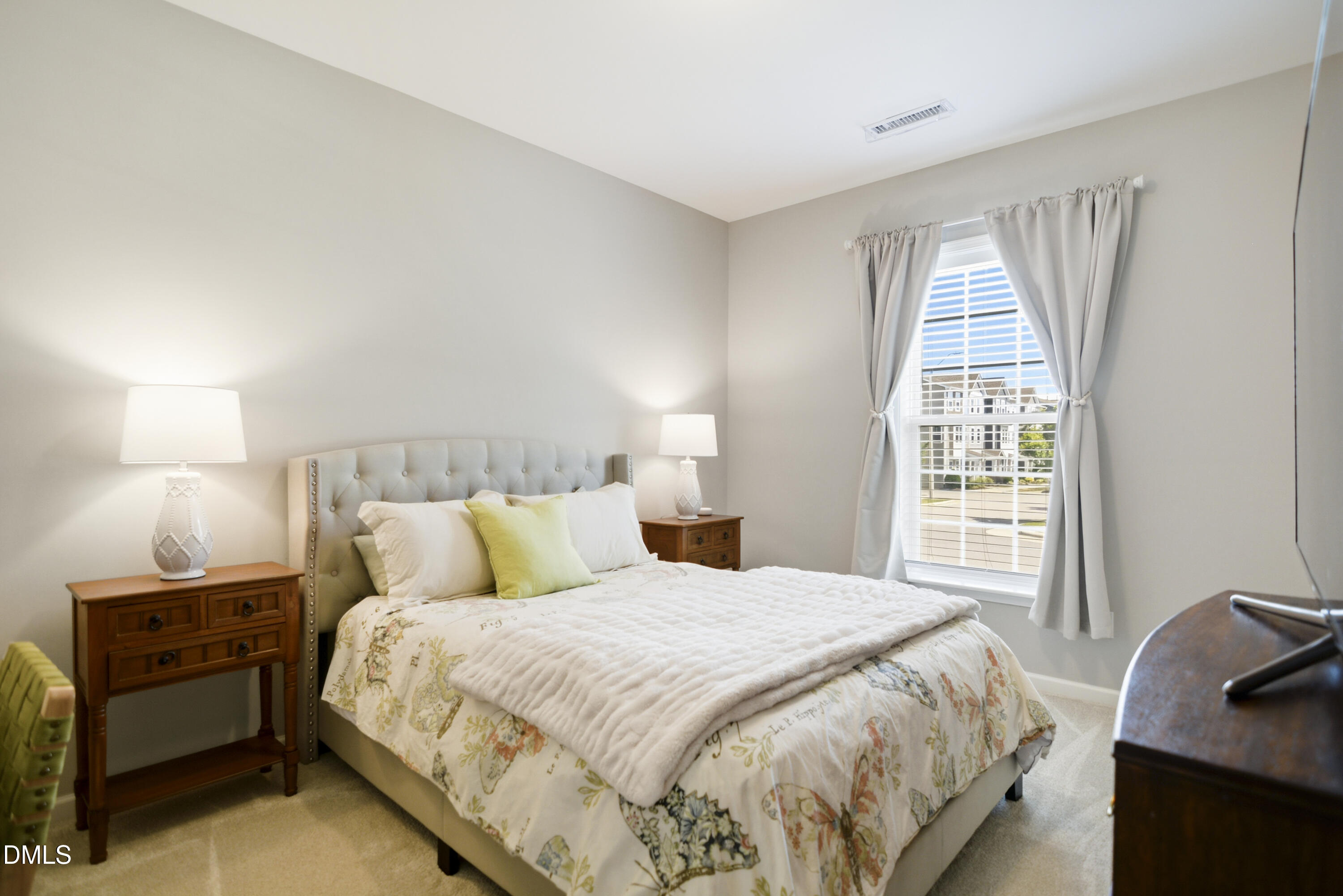 5916 Giddings Street Raleigh, NC 27616 - Photo 27 of 49 a bedroom with a bed and a window
