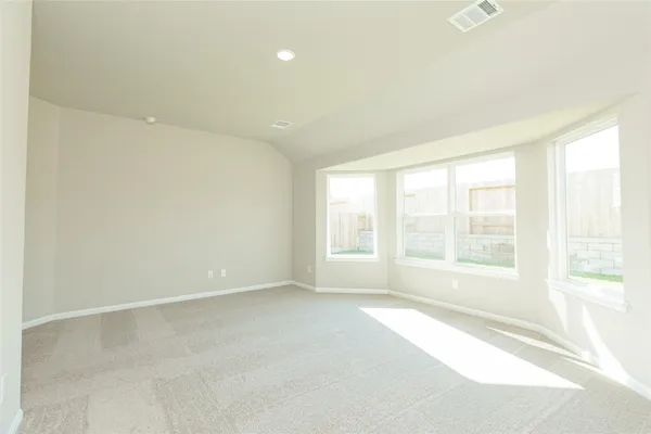 a view of an empty room with a window