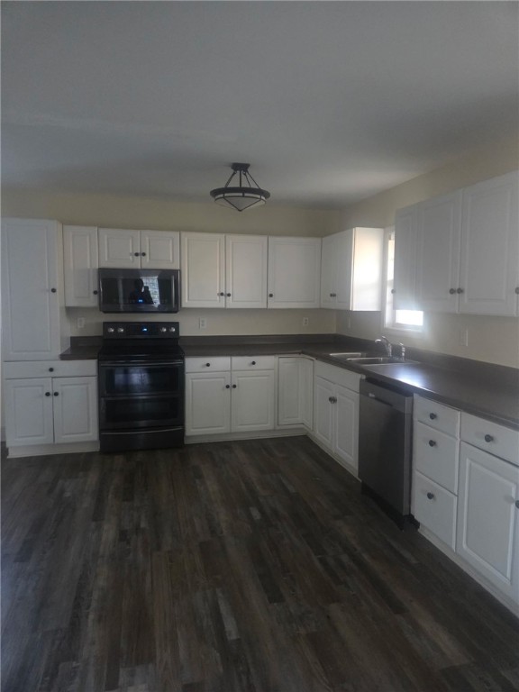 1051 Gage Drive Winder, GA 30680 - Photo 10 of 23 Open Concept Kitchen with microwave. dishwasher, electric stove & spacious dining area.