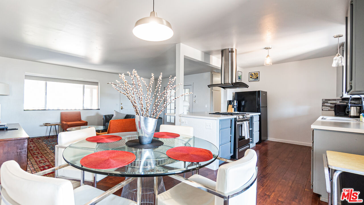 62033 Bonair Road Joshua Tree, CA 92252 - Photo 14 of 53 a dining room with furniture a chandelier and kitchen view