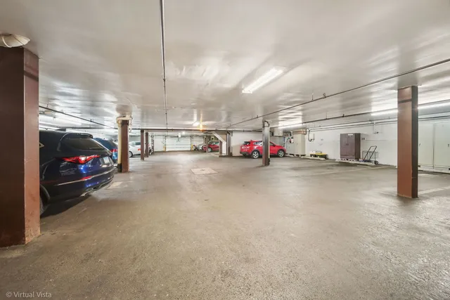 a view of parking area and car parked