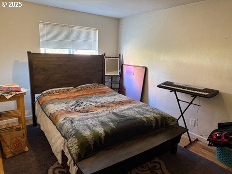170 East 40th Avenue Eugene, OR 97405 - Photo 8 of 10 a bedroom with a bed a dresser and window