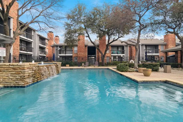 a view of a building with swimming pool