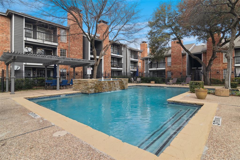 18333 Roehampton Drive, Unit 224 Dallas, TX 75252 - Photo 2 of 24 a view of a house with pool and trees