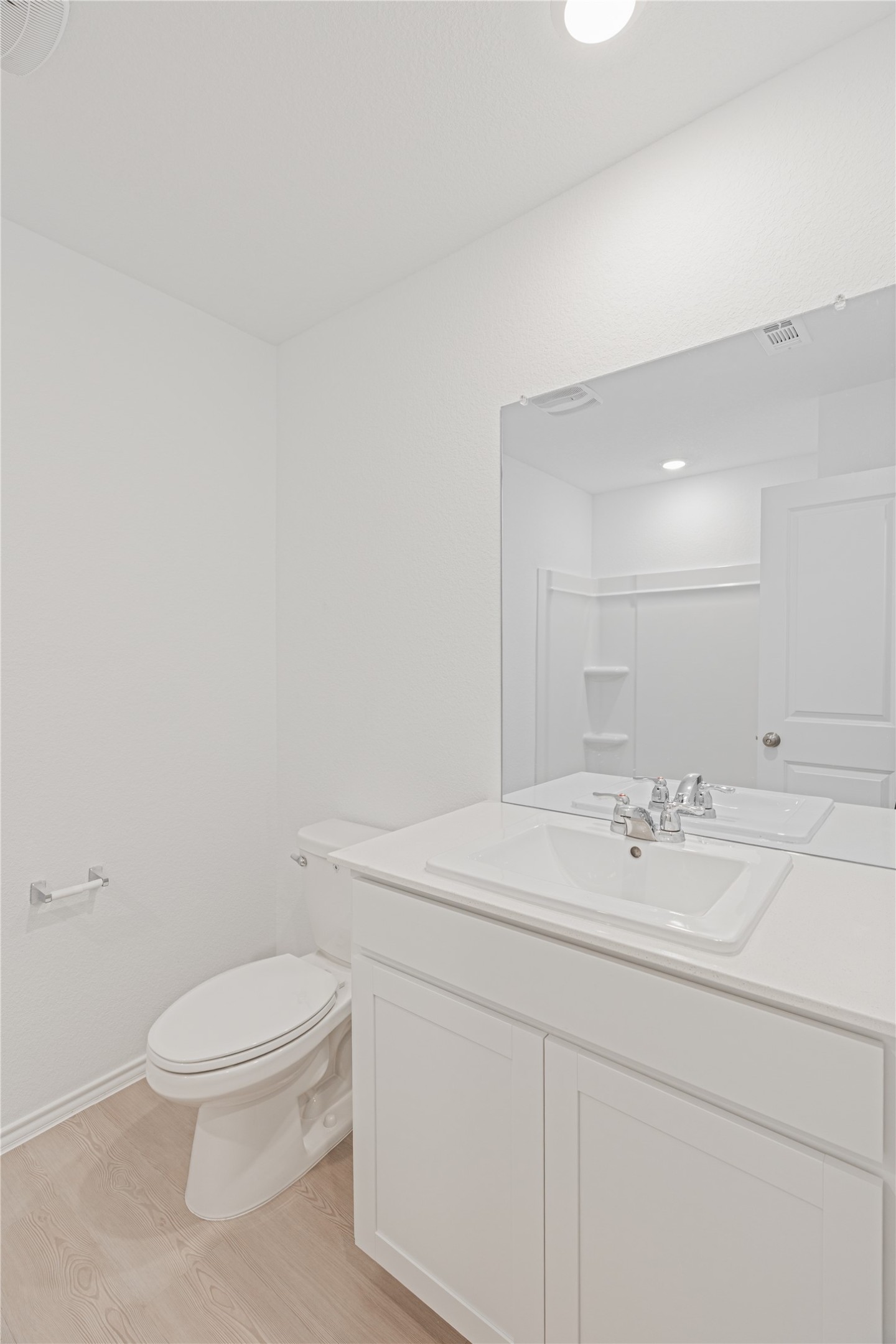 117 Dark Victory Road Jarrell, TX 76537 - Photo 18 of 24 Bathroom featuring light wood finished floors, vanity, and recessed lighting