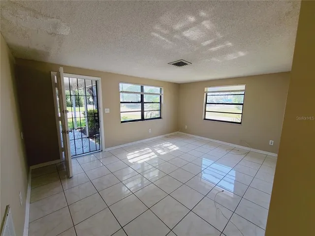 a view of an empty room and window