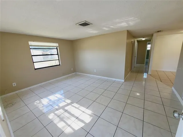 a view of an empty room and window