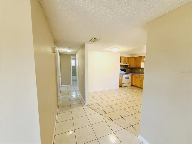 a view of a bathroom with a sink and a mirror