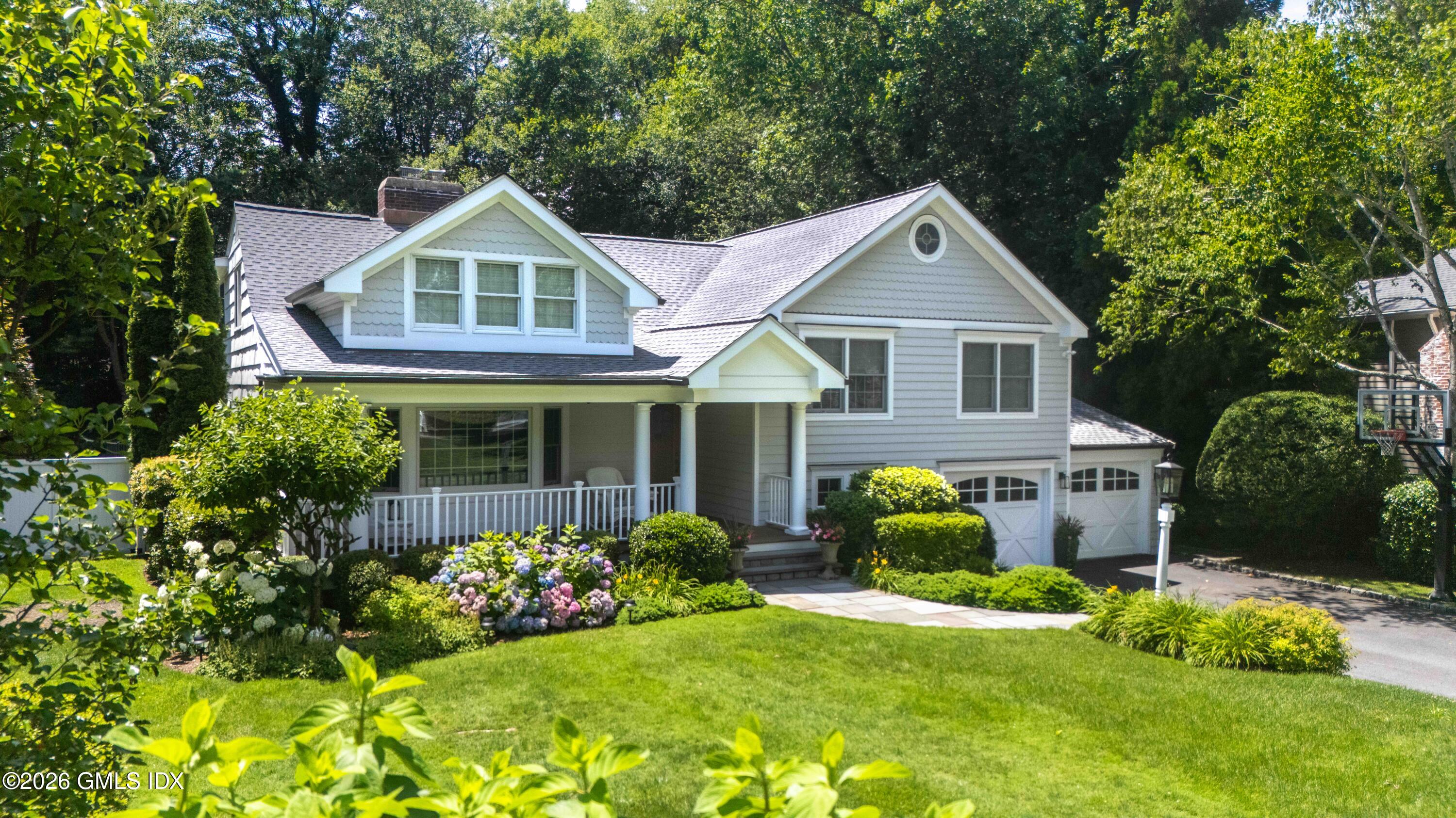 10 Verona Drive Riverside, CT 06878 - Photo 1 of 1 a front view of house with yard and green space