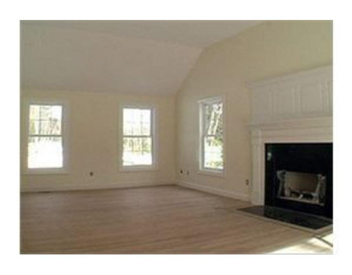 376 Mulpus Road Lunenburg, MA 01462 - Photo 5 of 8 a living room with furniture and a fireplace