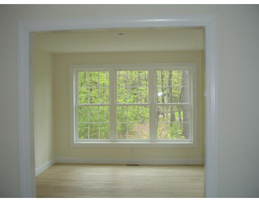 376 Mulpus Road Lunenburg, MA 01462 - Photo 8 of 8 a view of wooden floor and windows in a room