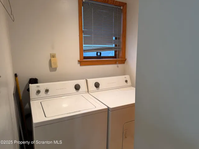 a bathroom with a sink a toilet and shower curtain
