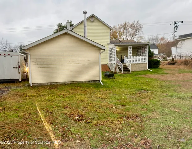 a house view with a backyard space