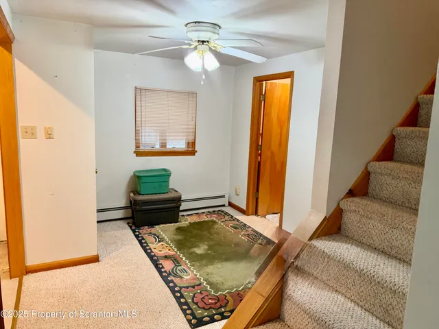 a living room with furniture and a rug