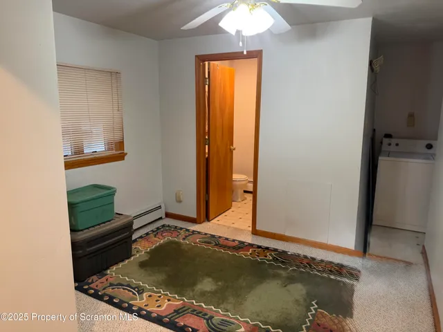 a living room with a bed