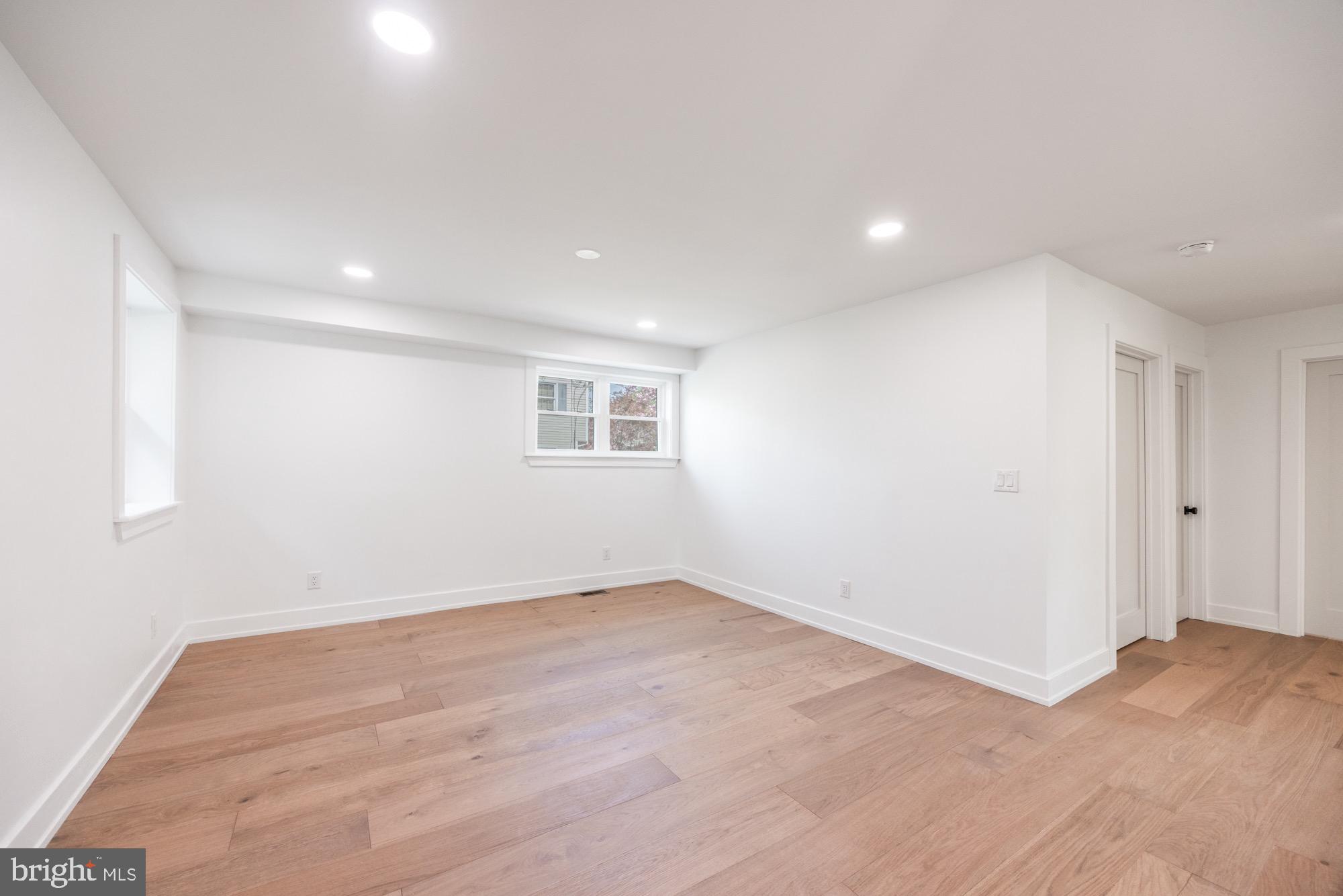 48 Mountainview Court Ewing, NJ 08628 - Photo 13 of 63 a view of a big room with wooden floor and windows