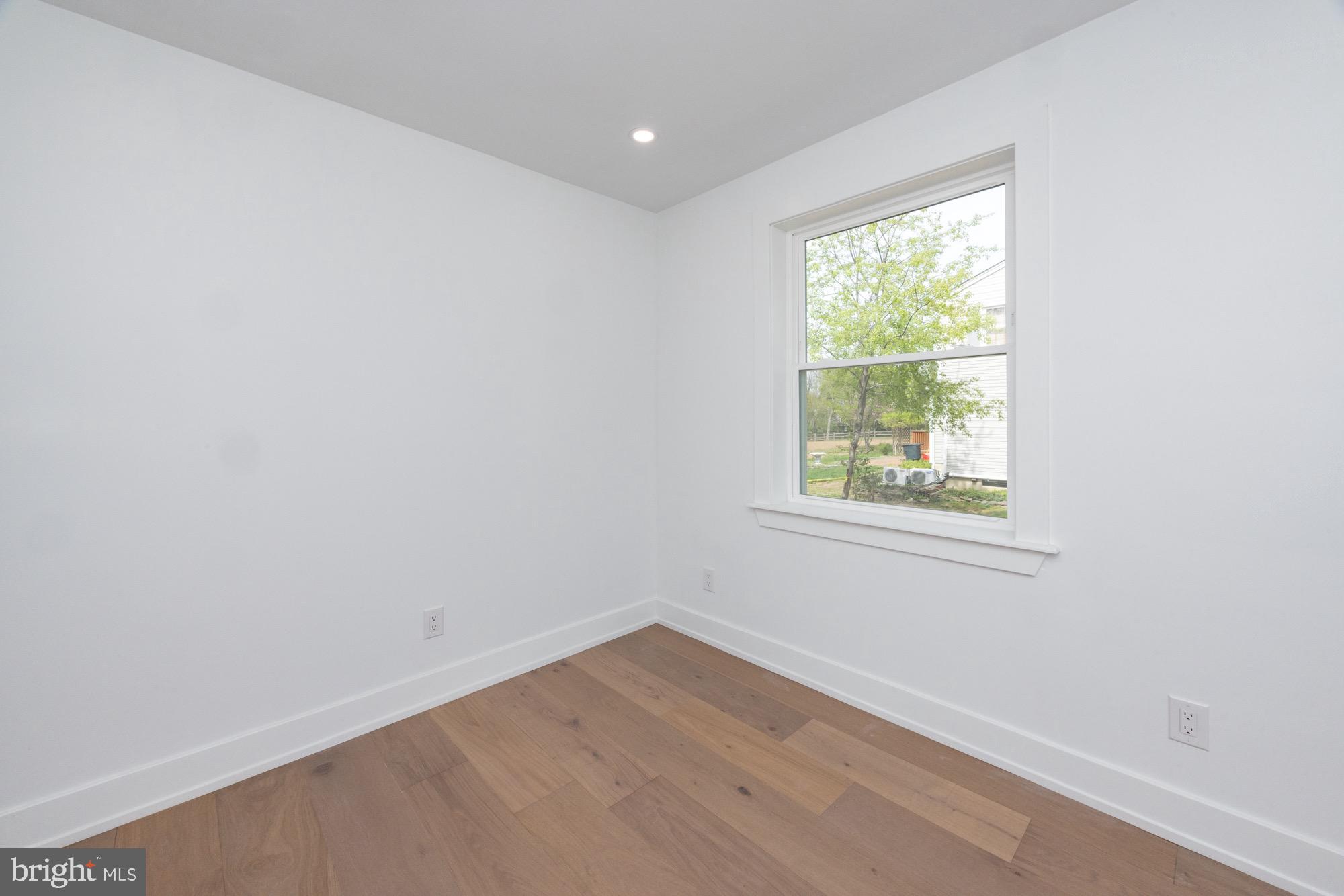 48 Mountainview Court Ewing, NJ 08628 - Photo 23 of 63 an empty room with wooden floor and windows