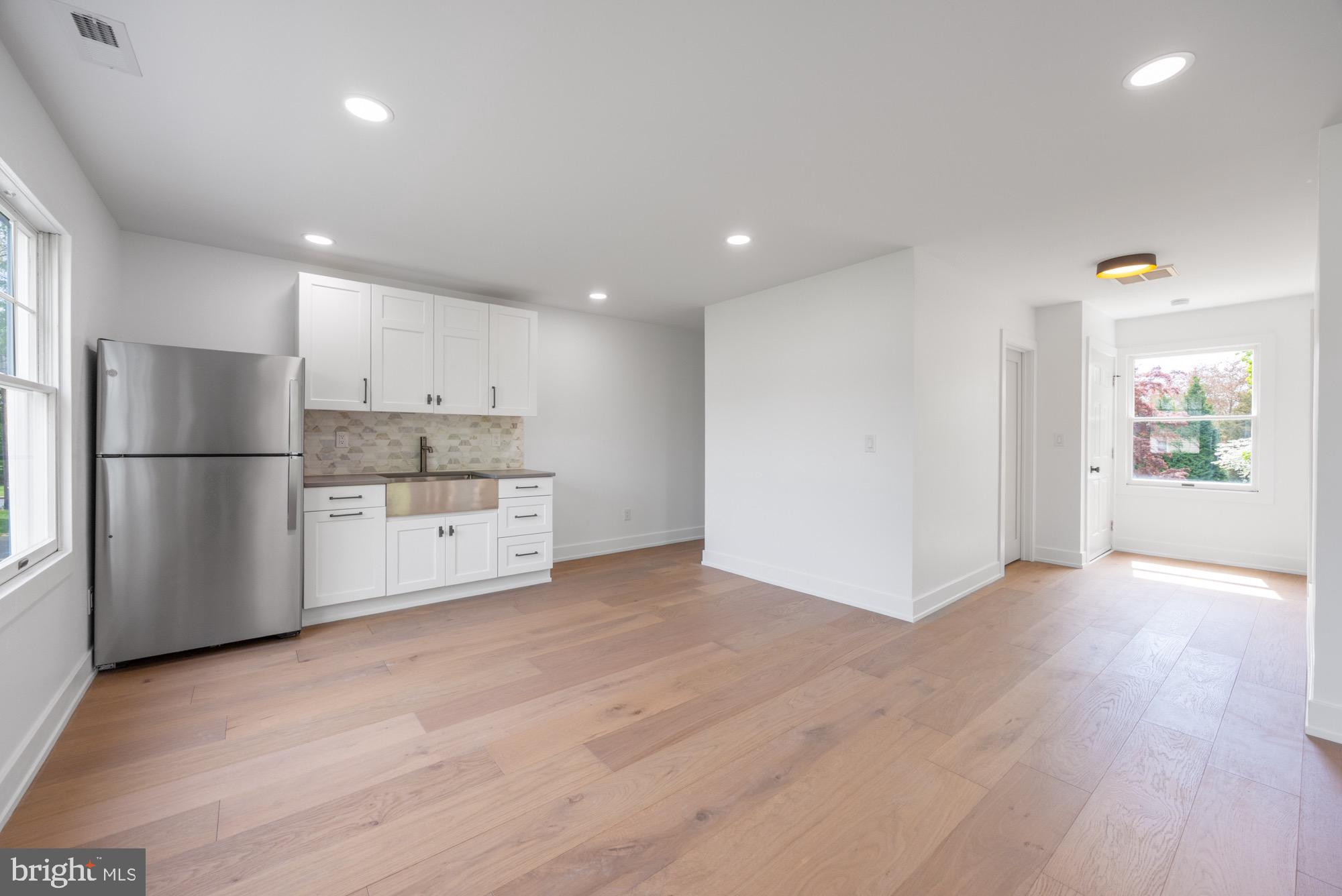 48 Mountainview Court Ewing, NJ 08628 - Photo 26 of 63 a view of a kitchen with wooden floor and electronic appliances